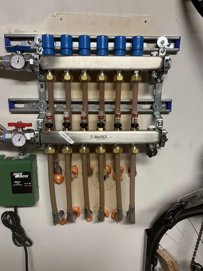 Plumber performing Water Heater Repair at a residential property in West Bend